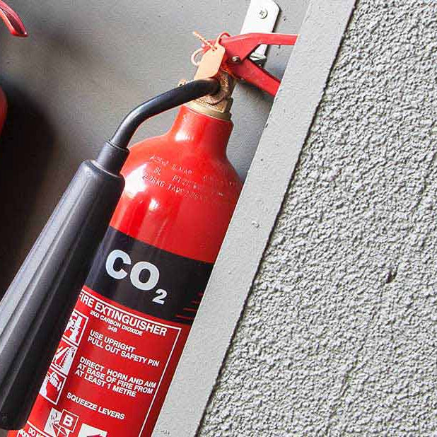 CO2 fire extinguisher attached to a wall
